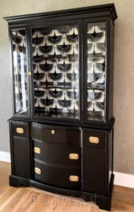 Modern black china cabinet. small black painted hutch. how to put wallpaper in furniture. how to paint furniture black. best black paint for furniture