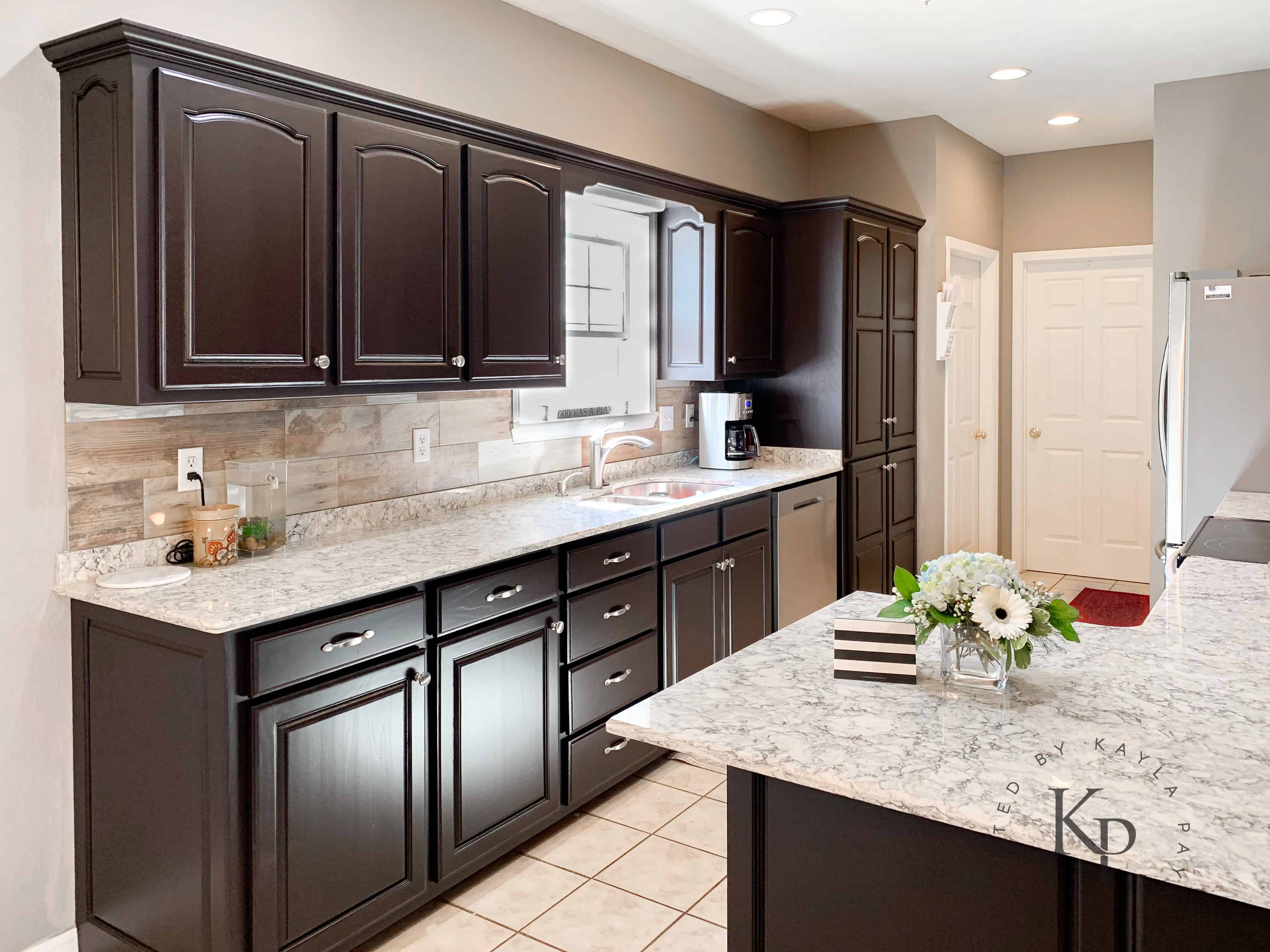 dark brown kitchen cabinet with light countertops
