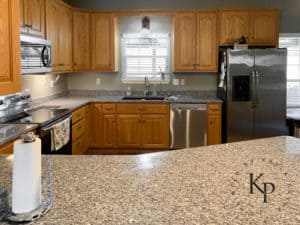 After photo of painted oak kitchen cabinets in Benjamin Moore Soft Chamois