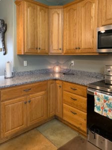 After photo of painted oak kitchen cabinets in Benjamin Moore Soft Chamois