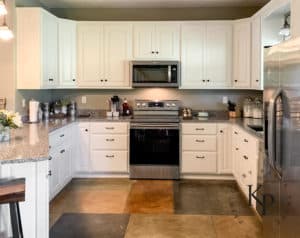 After photo of painted oak kitchen cabinets in Benjamin Moore Soft Chamois