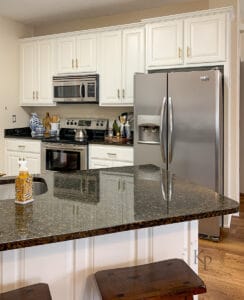 cabinets in a kitchen that are painted white